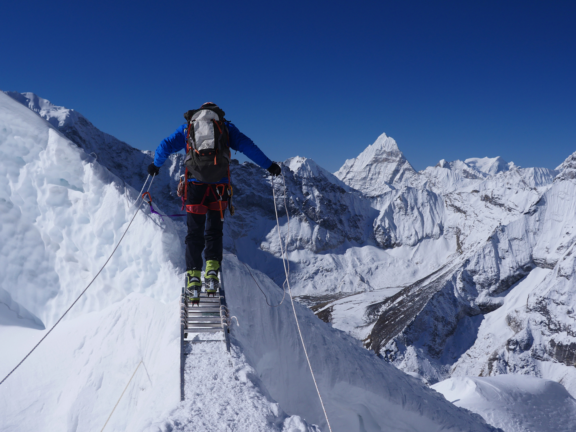 Crossing a ladder high on Island Peak, Nepal