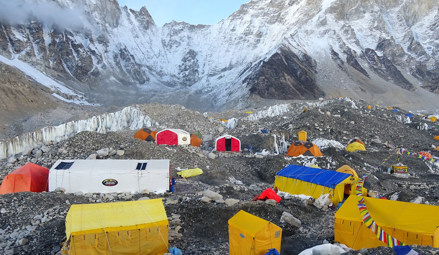 Bright and colourful tents bring life to the barren moraine of the Khumbu Glacier.