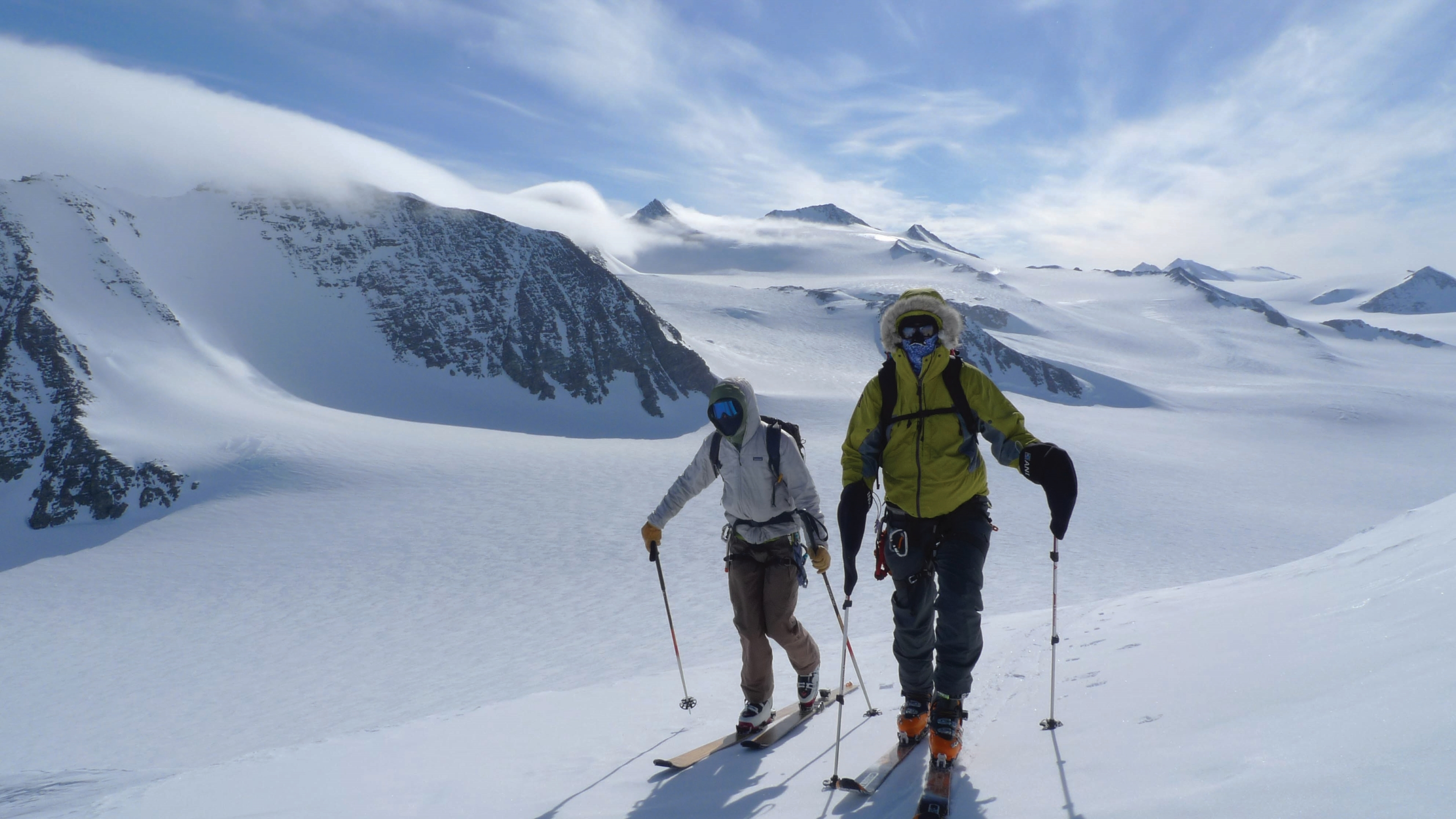 Cold conditions as two skiers tour uphill in the Ellsworth mountains