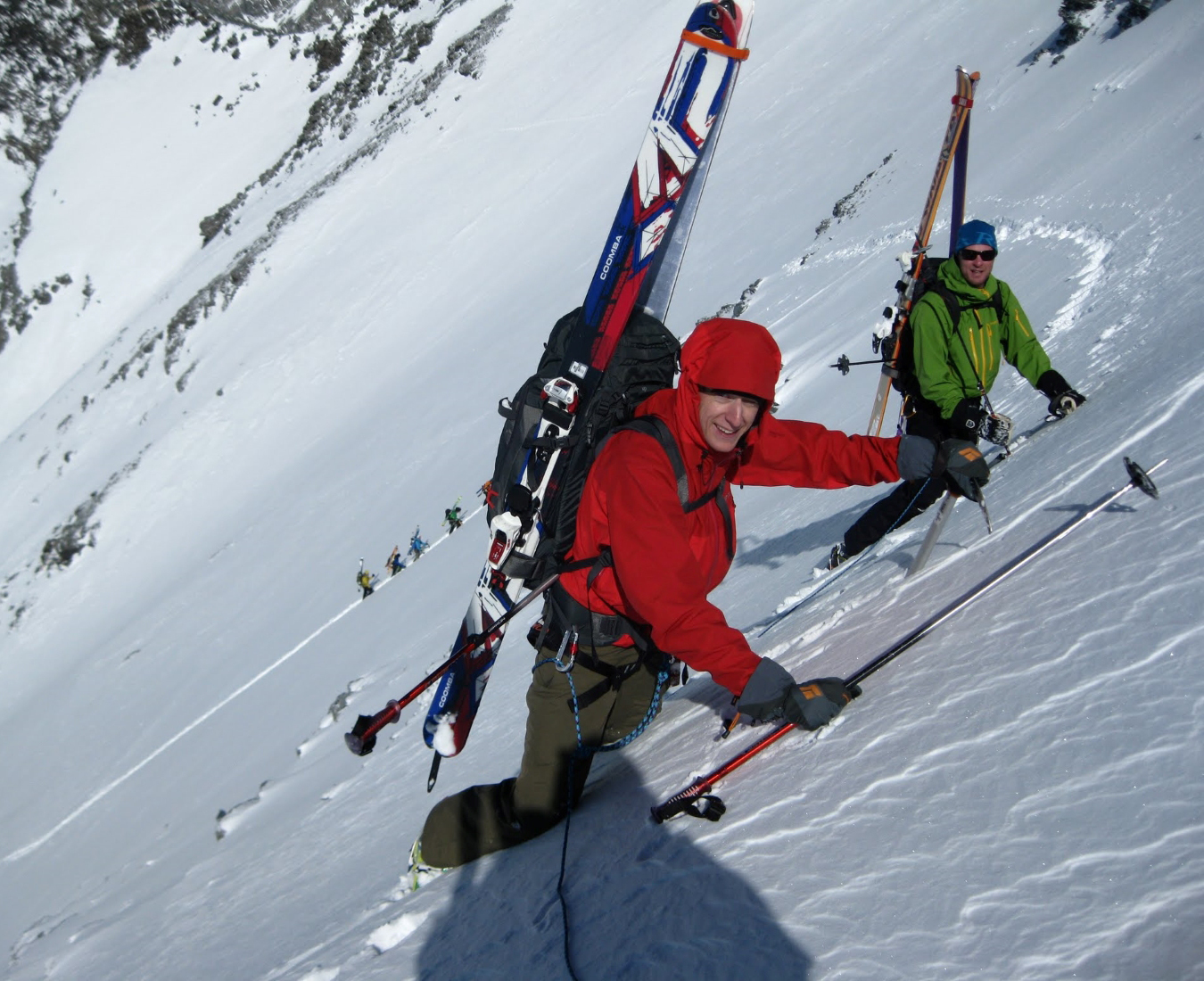 Two backcountry skiers ascend a steep slope on the classic Europe Haute Route ski tour.