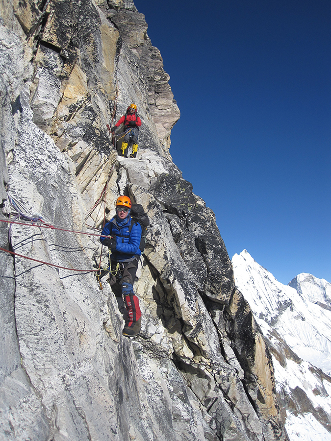 Negotiating steep rock faces on the approach to Camp 1 Ama Dablam