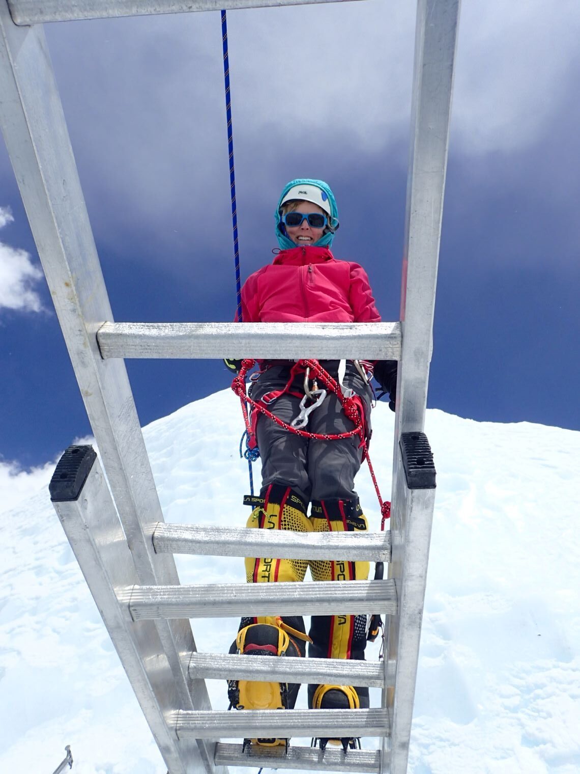 Crossing a ladder in the Khumbu icefall on Mt Everest