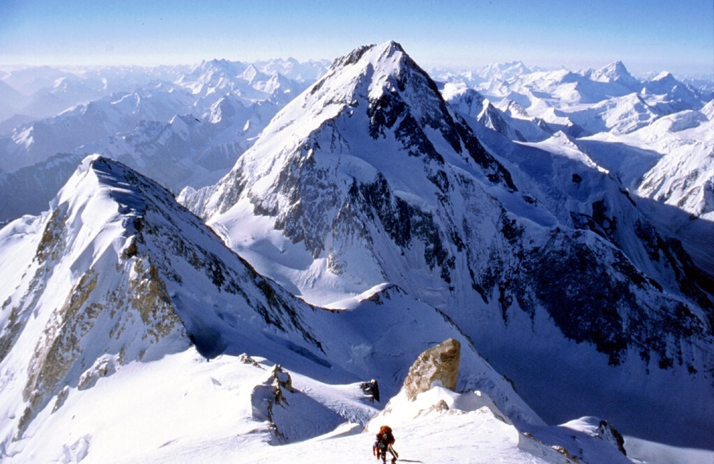 Climber close to summit of Gasherbrum 2 with Gasherbrum 1 behind
