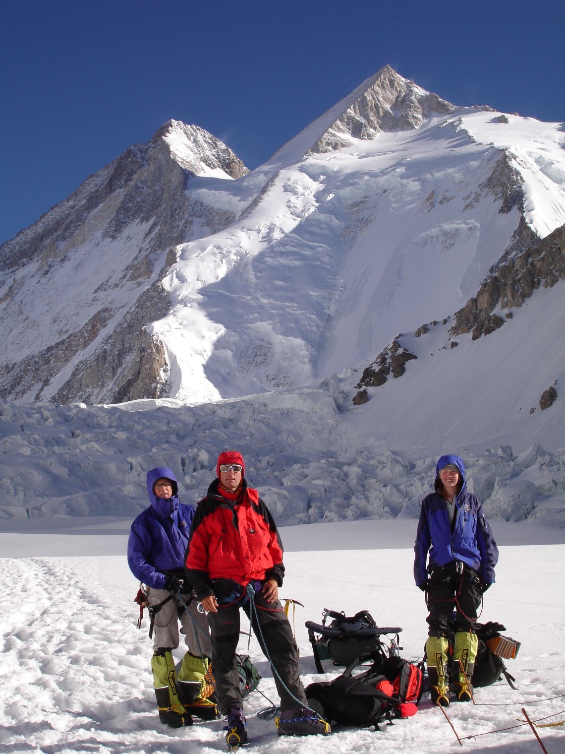Climbers at camp 1 location with Gasherbrum 2 behind