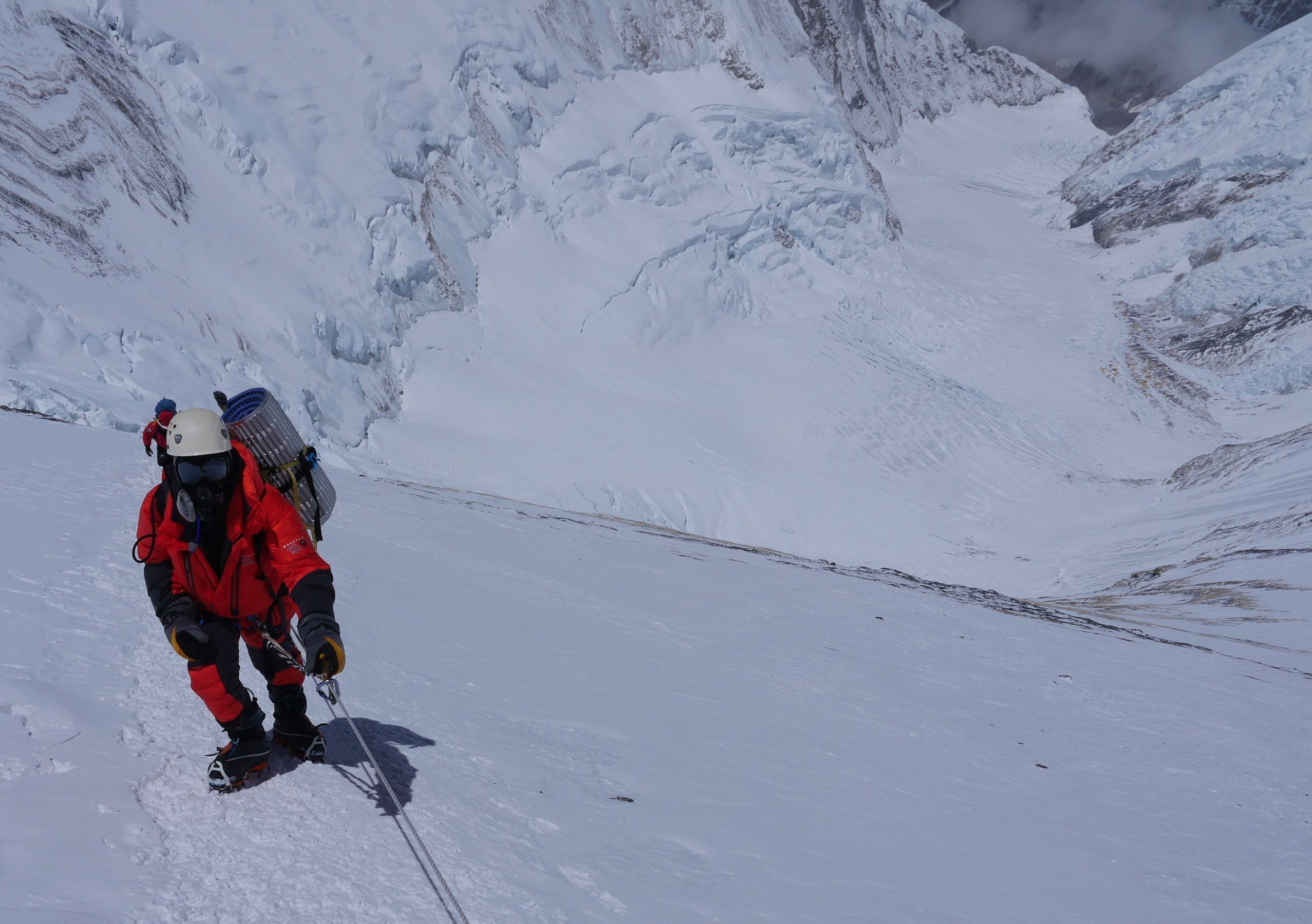Climber above the yellow band on route to Lhotse high camp with western CWM below