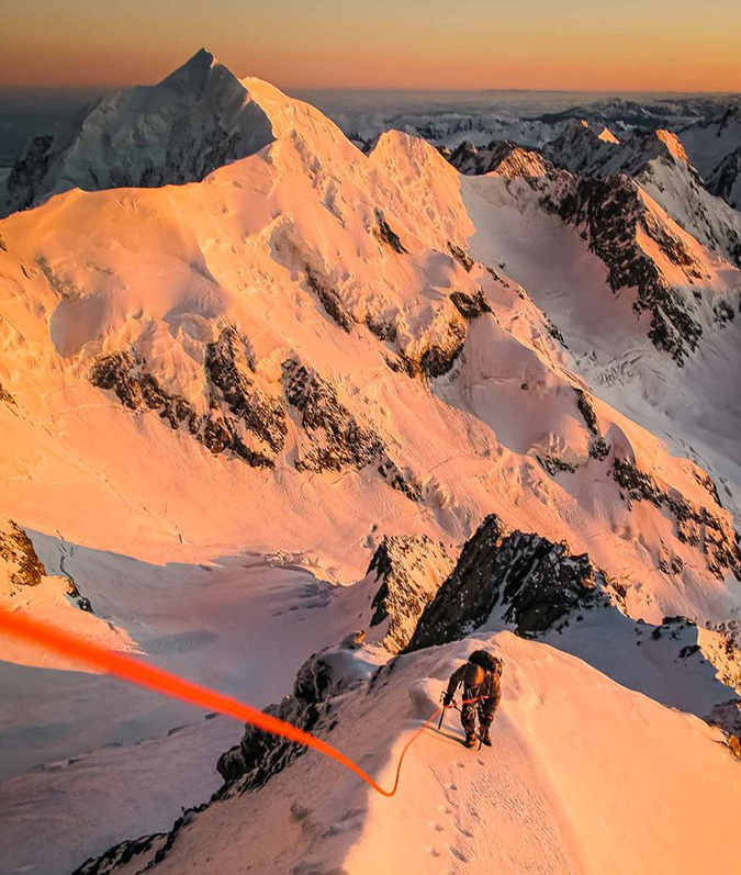 A roped climber moves up the ridge above the Linda Glacier on Aoraki Mount Cook