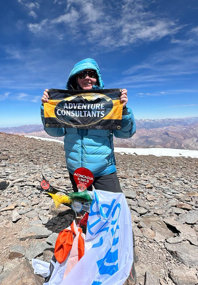 AC Climber celebrates on the summit of South America's highest peak, Mt Aconcagua