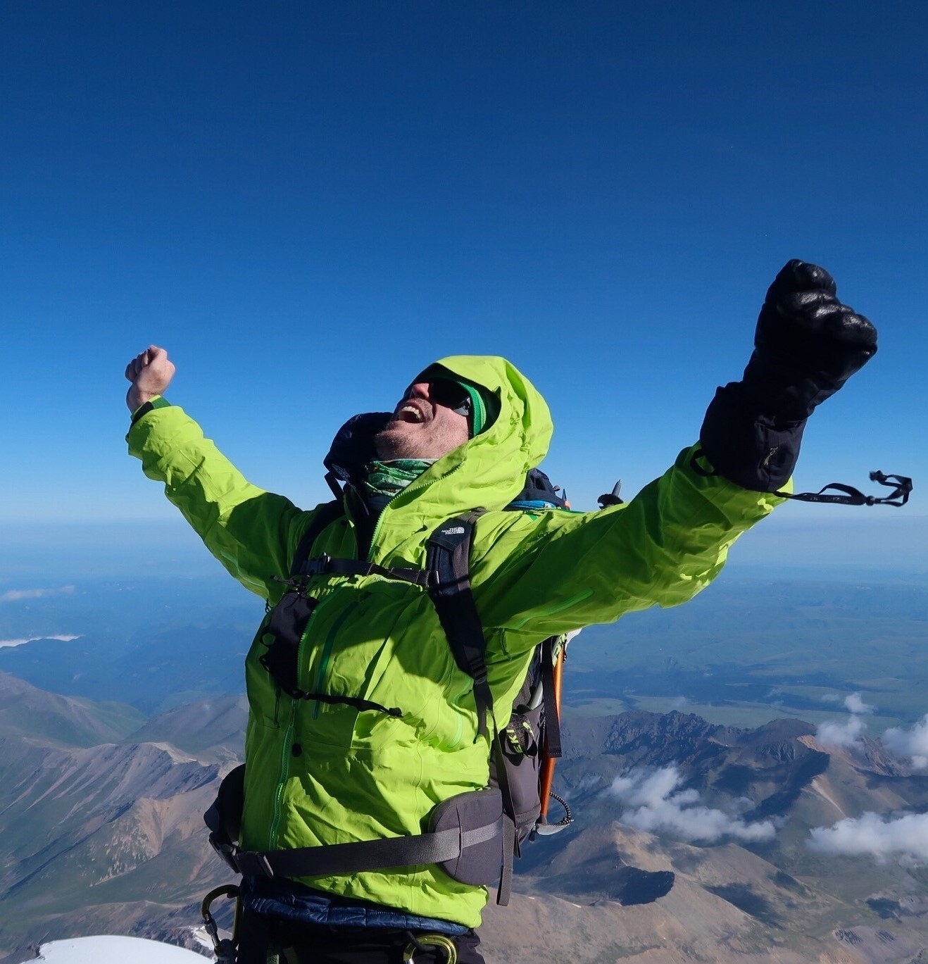 Climber celebrating on top of Mt Elbrus